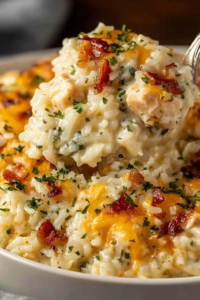 Angel Chicken and Rice Casserole baked golden and bubbly in a white 9x13 baking dish