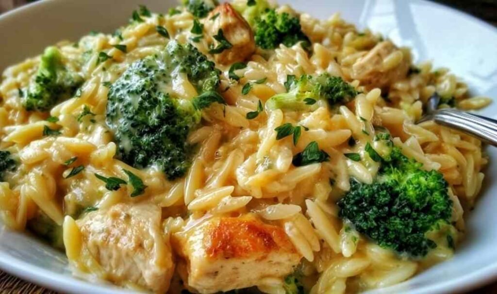 Homemade broccoli cheddar soup served in a rustic bowl topped with melted cheddar and fresh broccoli florets