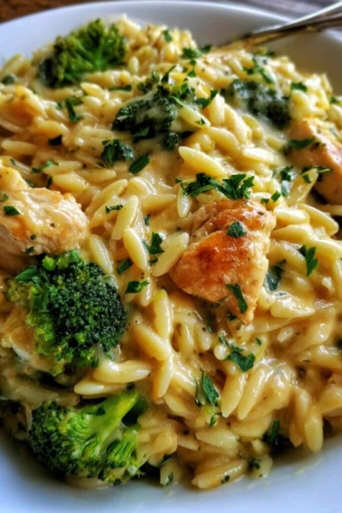 Homemade broccoli cheddar soup served in a rustic bowl topped with melted cheddar and fresh broccoli florets