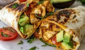 Chicken Avocado Wrap Ingredients for Chicken Avocado Wrap on a wooden board