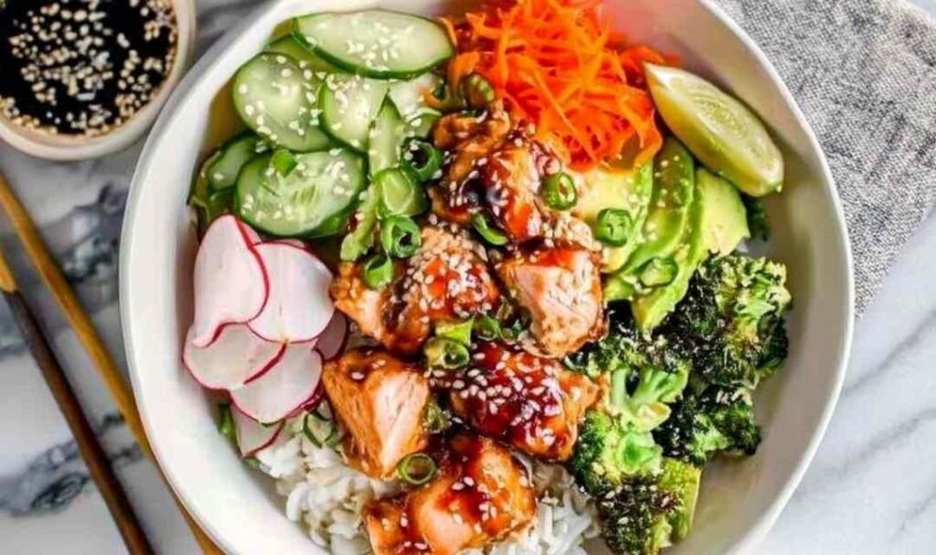 Crispy salmon bowls with avocado and cucumber over rice.