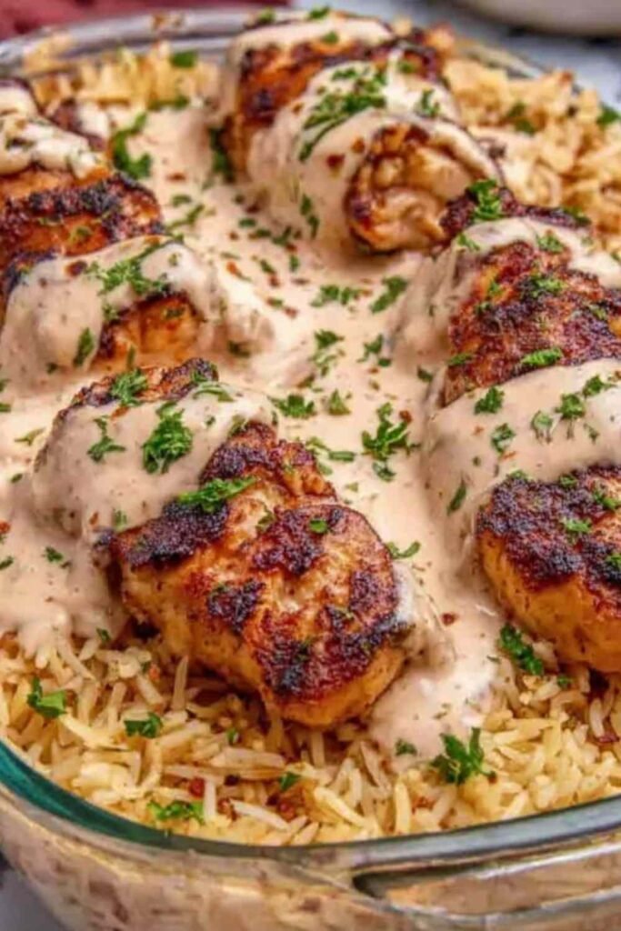 High Protein Cajun Chicken Rice in a bowl with parsley garnish