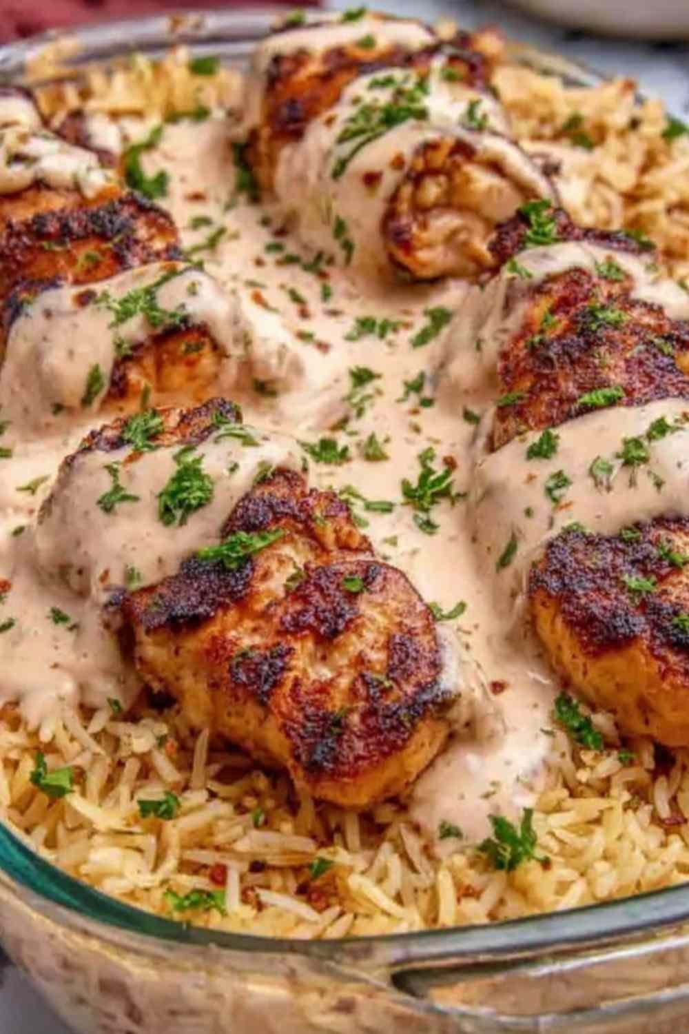 High Protein Cajun Chicken Rice in a bowl with parsley garnish