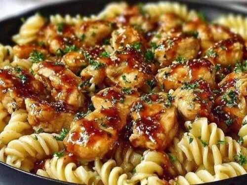 One Pot Honey Garlic BBQ Chicken Pasta cooking in a pot on the stove
