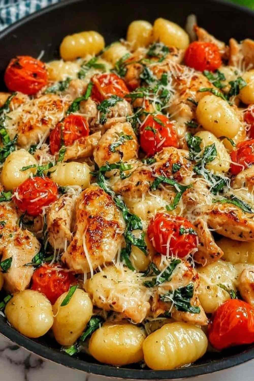 Savory Garlic Chicken and Gnocchi Skillet Recipe in a cast iron pan