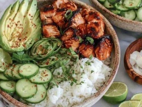 Spicy Salmon Bowl Recipe salmon cooking in a skillet with glaze