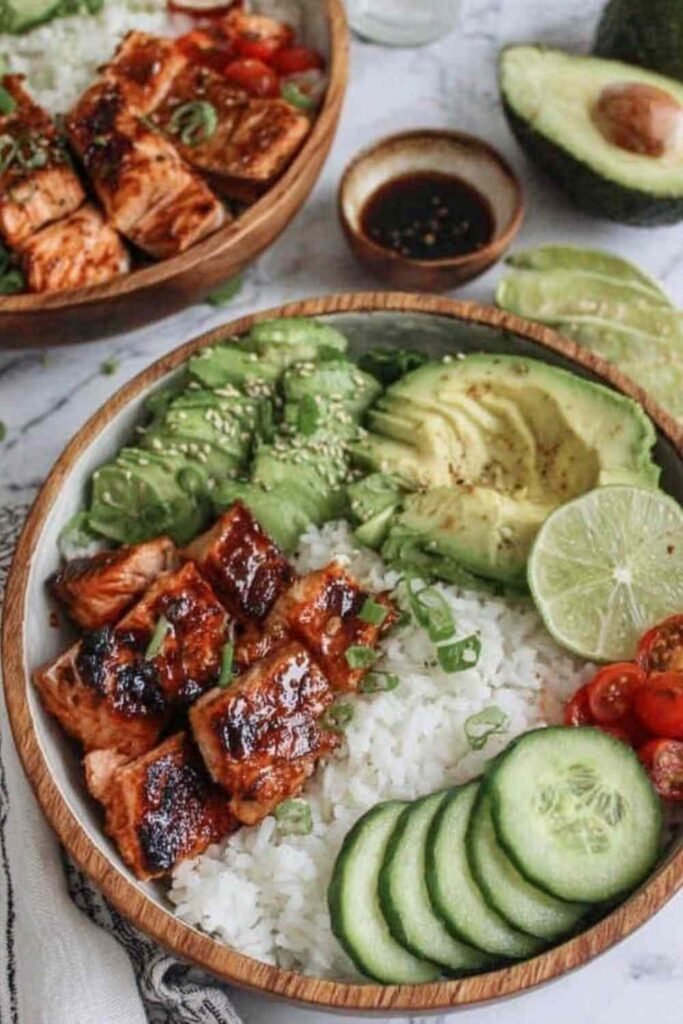Spicy Salmon Bowl Recipe salmon cooking in a skillet with glaze