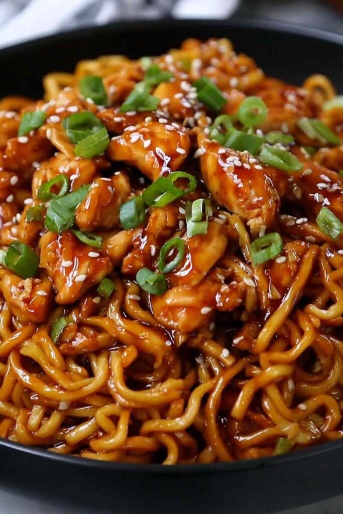 Sticky Garlic Chicken Noodles Recipe served in a bowl