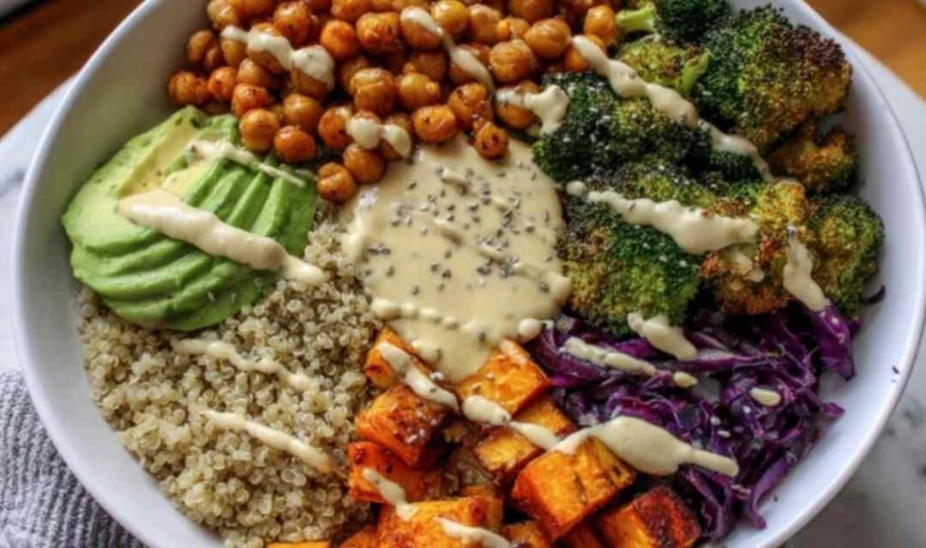 Fresh ingredients for a Vegan Buddha Bowl arranged on a wooden countertop