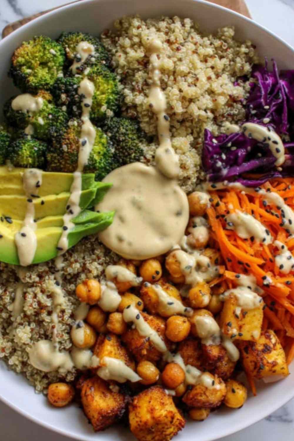 Fresh ingredients for a Vegan Buddha Bowl arranged on a wooden countertop