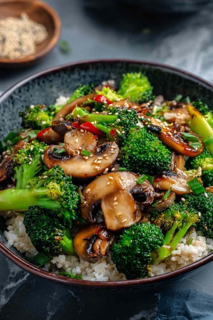 Fresh broccoli florets and sliced mushrooms prepped for a broccoli and mushroom stir fry