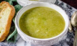 A pot of freshly cooked 30 minute frozen pea soup on a stove