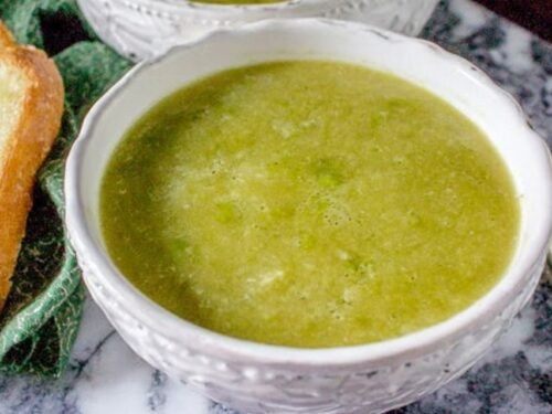 A pot of freshly cooked 30 minute frozen pea soup on a stove