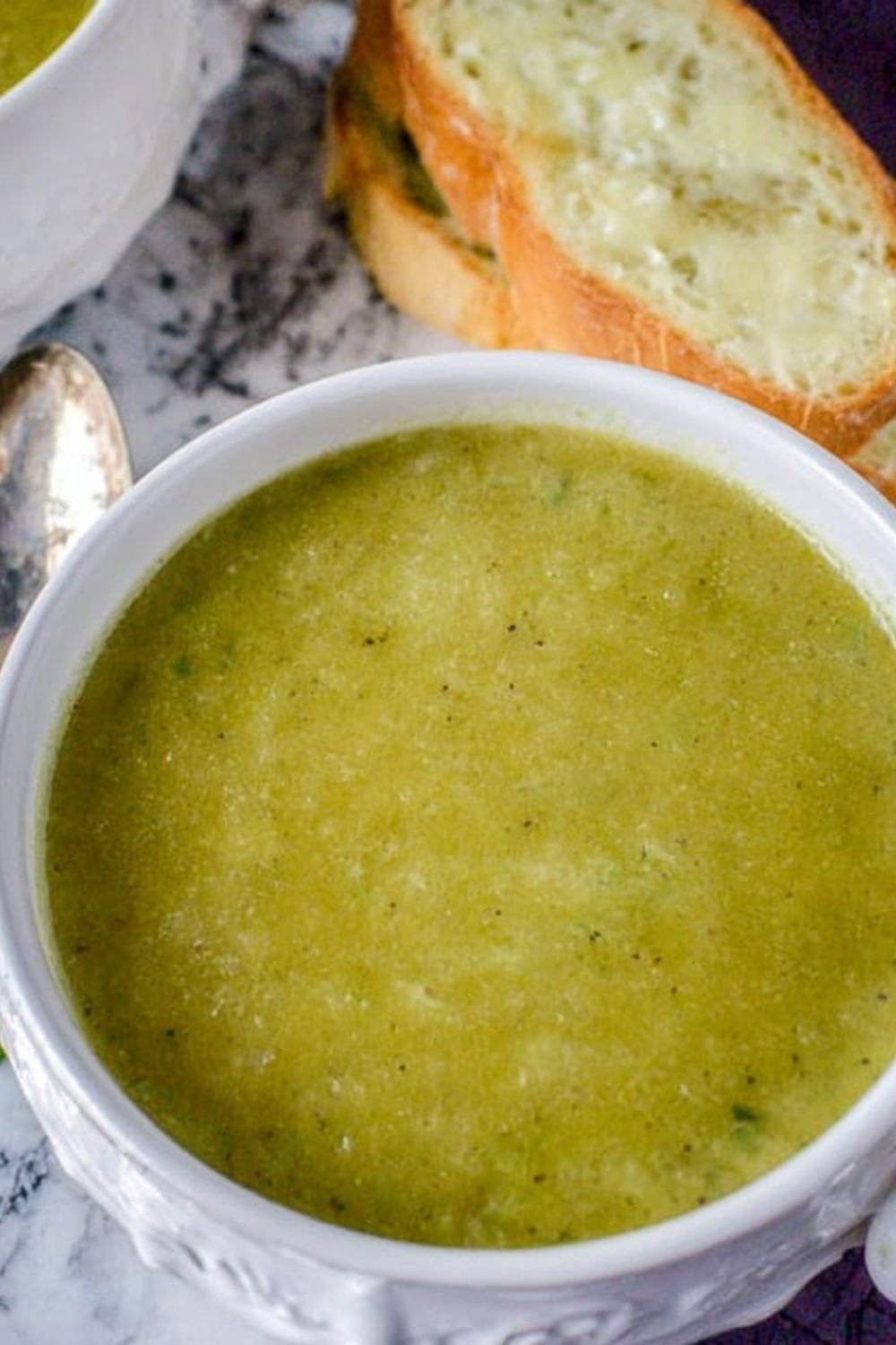 A pot of freshly cooked 30 minute frozen pea soup on a stove