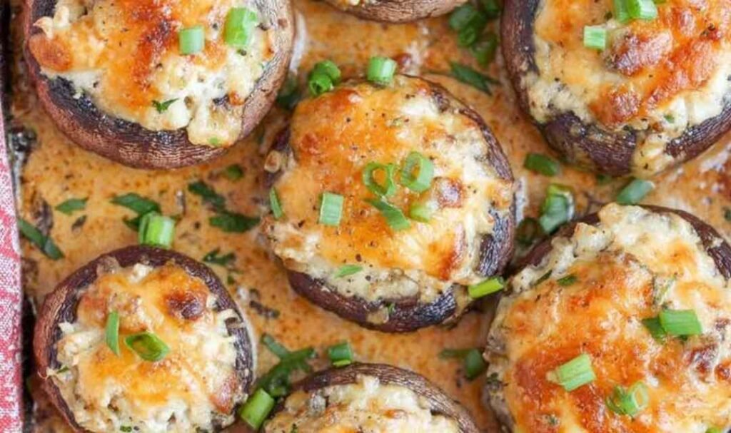 Raw bacon blue cheese stuffed mushrooms in a baking dish ready for the oven