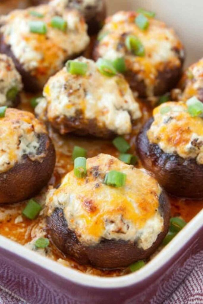 Raw bacon blue cheese stuffed mushrooms in a baking dish ready for the oven