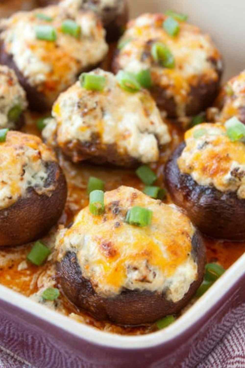 Raw bacon blue cheese stuffed mushrooms in a baking dish ready for the oven