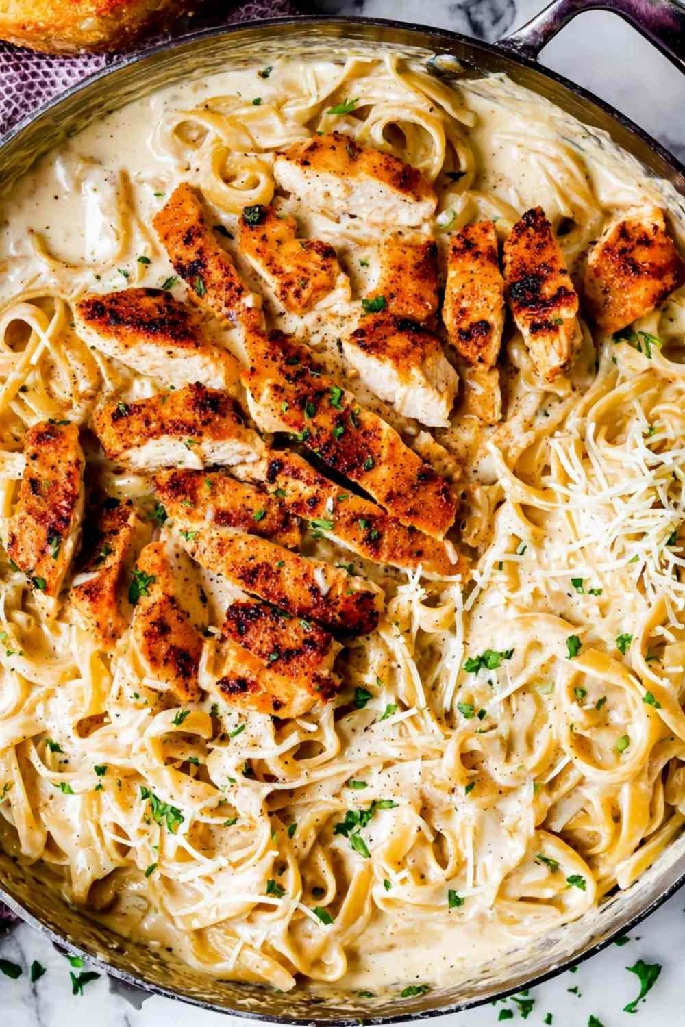 Sliced chicken cutlets seasoned with paprika for chicken fettuccine alfredo