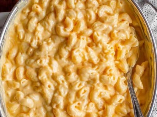 Easy stovetop mac and cheese in a skillet with a creamy sharp cheddar sauce coating the elbow macaroni