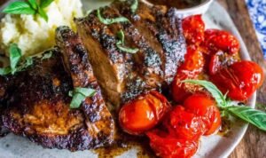 Chicken pieces resting in a balsamic grilled chicken marinade inside a plastic bag