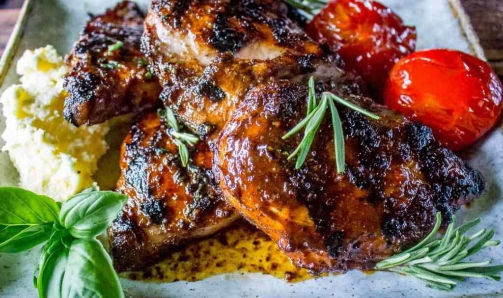 Chicken pieces resting in a balsamic grilled chicken marinade inside a plastic bag