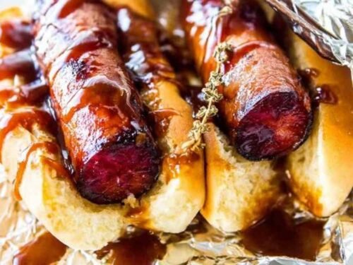 JDawgs special sauce copycat hot dogs served in buttered toasted buns with sweet tangy sauce drizzled on top