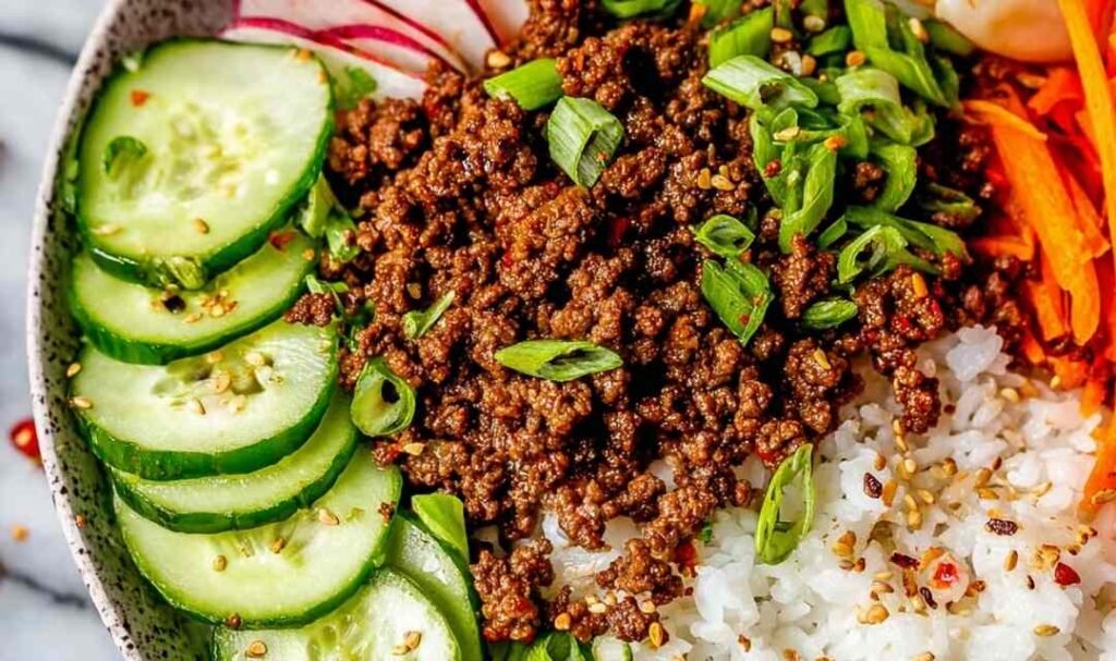 Korean Beef Recipe cooking in a cast iron skillet