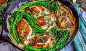 Bacon wrapped hot dogs grilling over low heat with crispy golden bacon on an outdoor grill