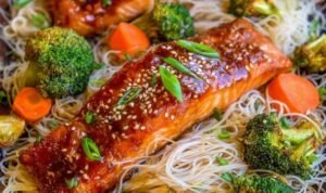 Sheet pan Asian salmon with broccoli Sheet pan Asian salmon with broccoli and carrots roasted in soy ginger sauce on a rimmed sheet pan