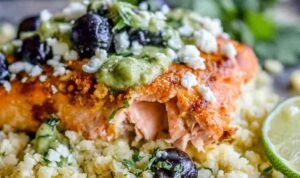 Sheet pan honey chipotle salmon with cauliflower rice Sheet pan honey chipotle salmon with cauliflower rice, black beans, and avocado coconut cream on a baking sheet