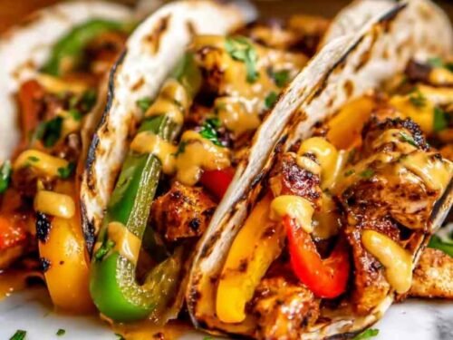 Raw chicken thighs sliced in a bowl with chicken fajitas marinade