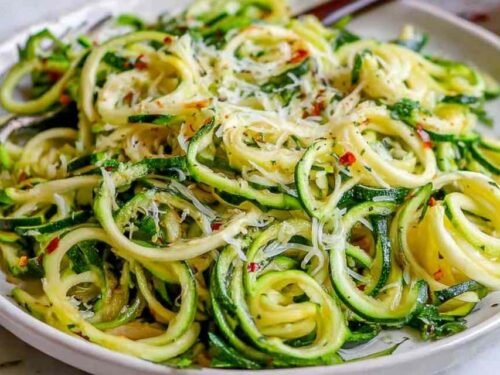 How to make zoodles — sautéed zucchini noodles in a skillet with garlic and Parmesan cheese