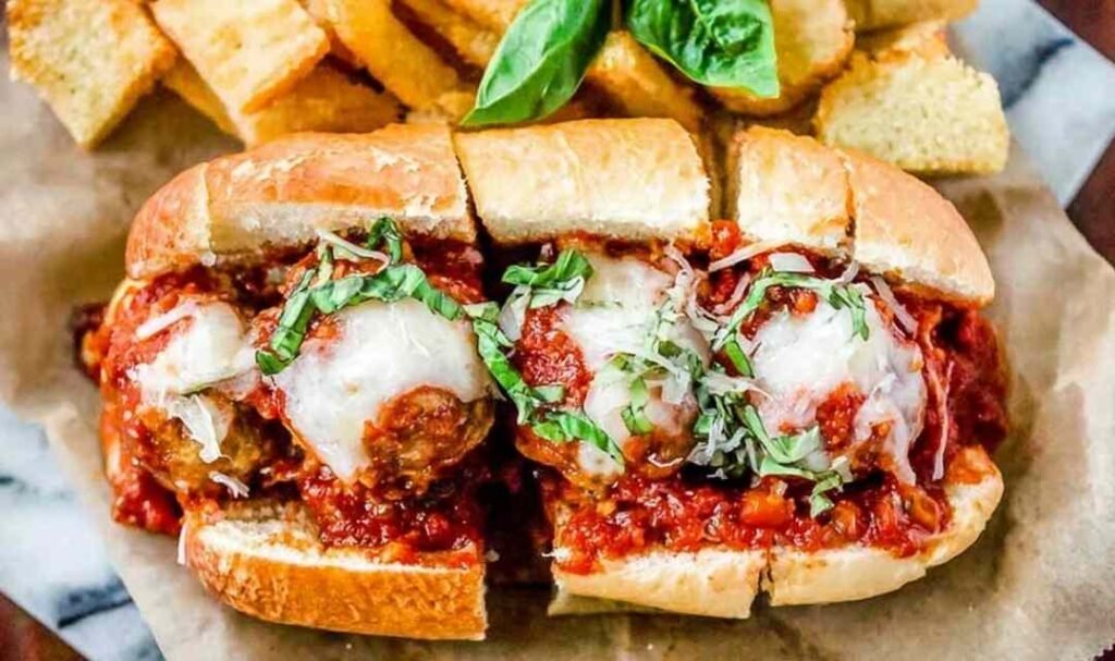 Ingredients for an easy meatball sub recipe including diced onions and canned tomatoes.