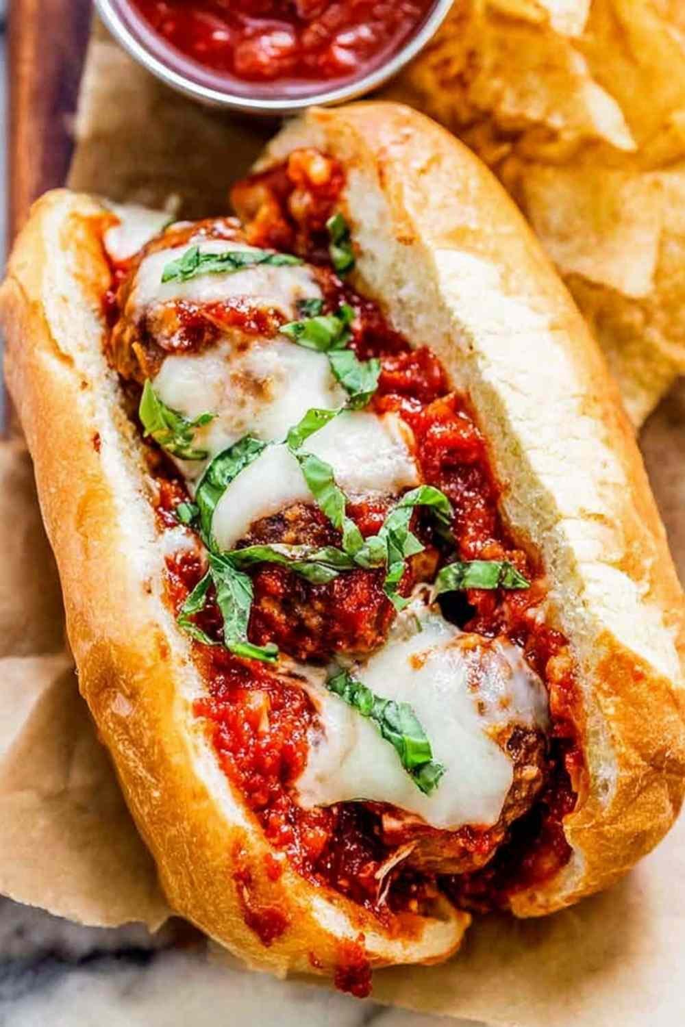 Ingredients for an easy meatball sub recipe including diced onions and canned tomatoes.